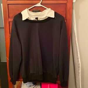 Black and white colored sweater. Good condition. Sized 2.